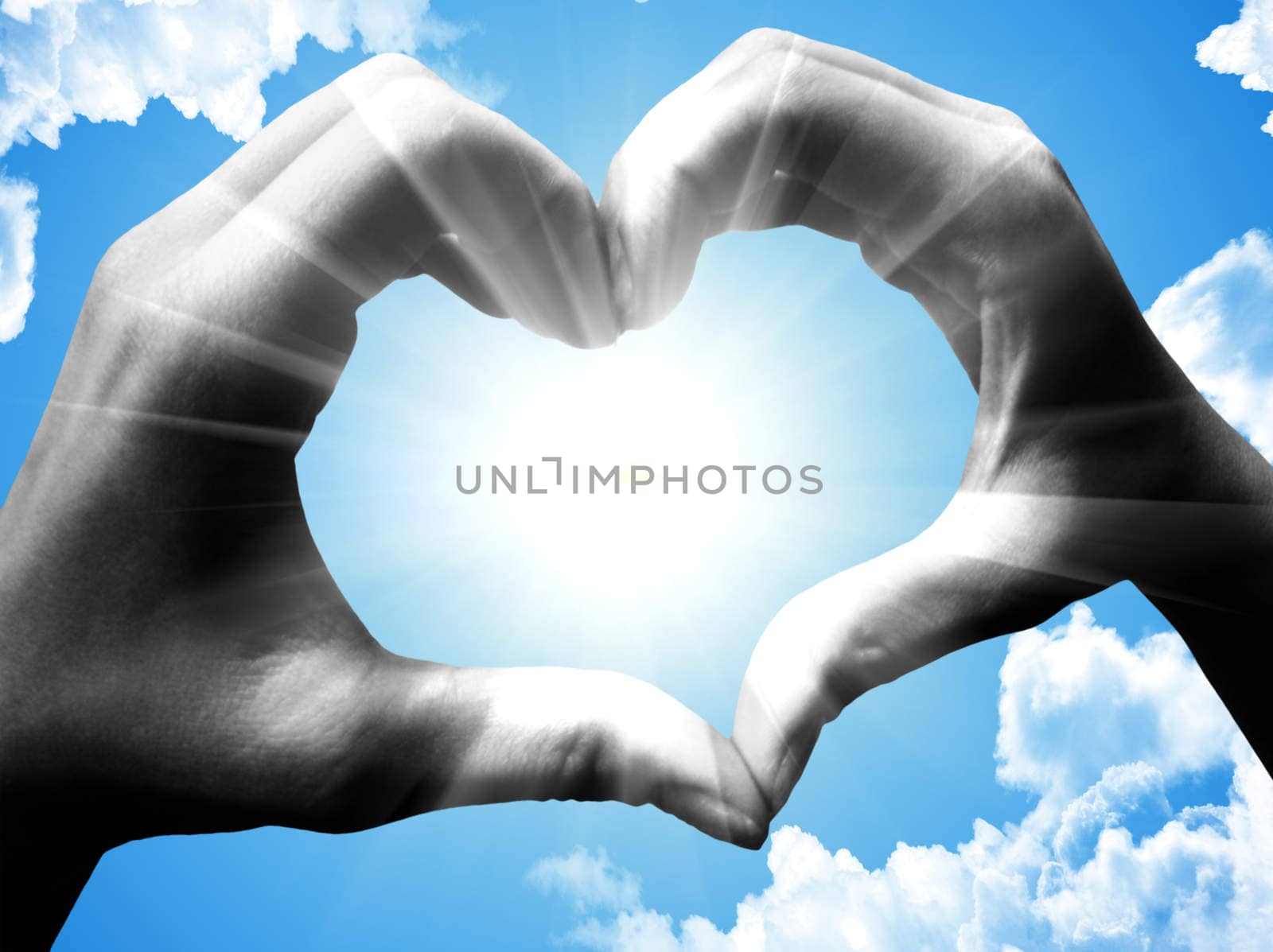 love shape hand silhouette in sky
