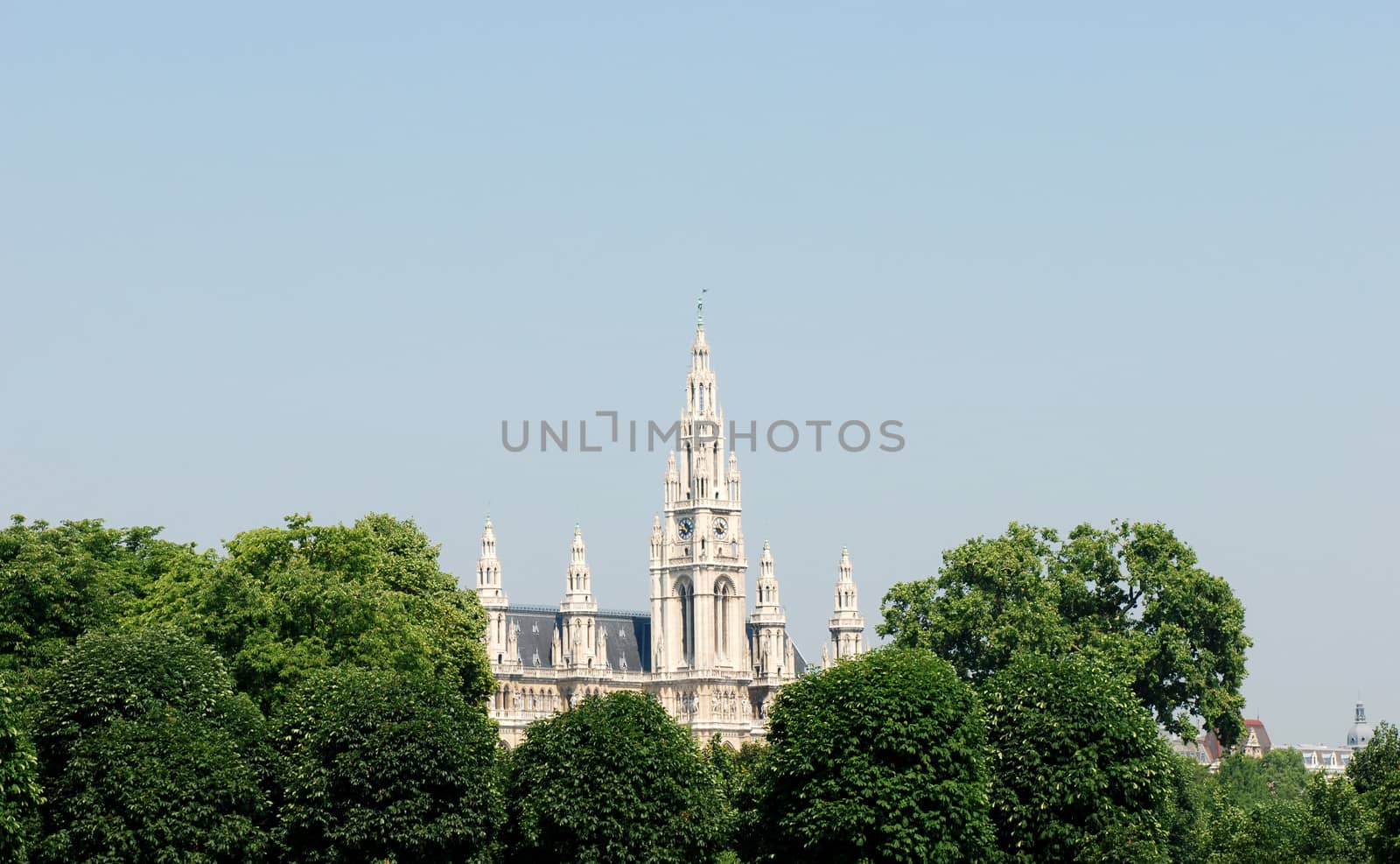 The spires of the Rathaus (City Hall) rise above the trees in Heldenplatz, Vienna