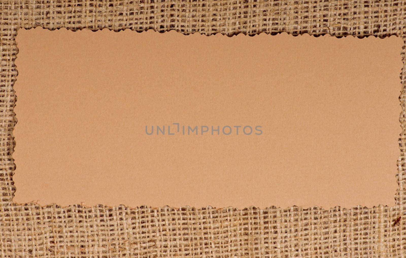 Old paper tag on natural burlap