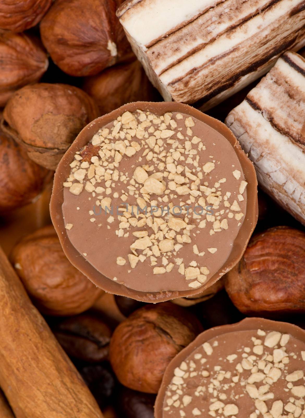 Closeup of coffee beans, cinnamon and nuts