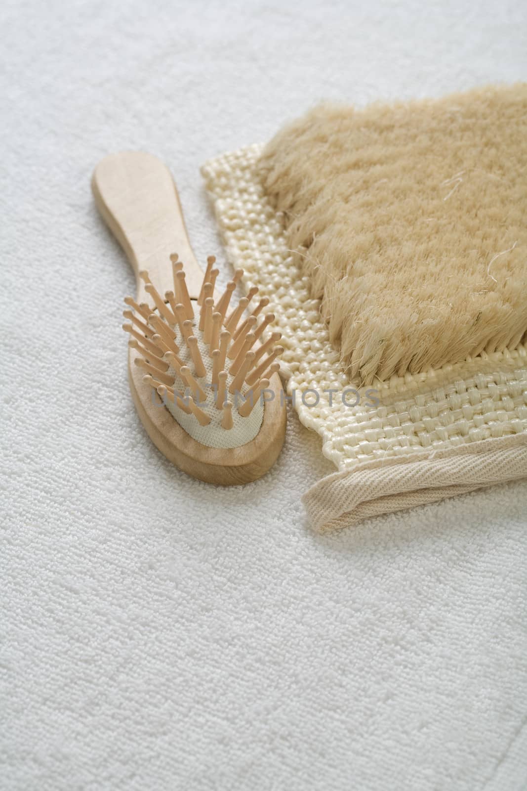 hairbrush and bast on white background