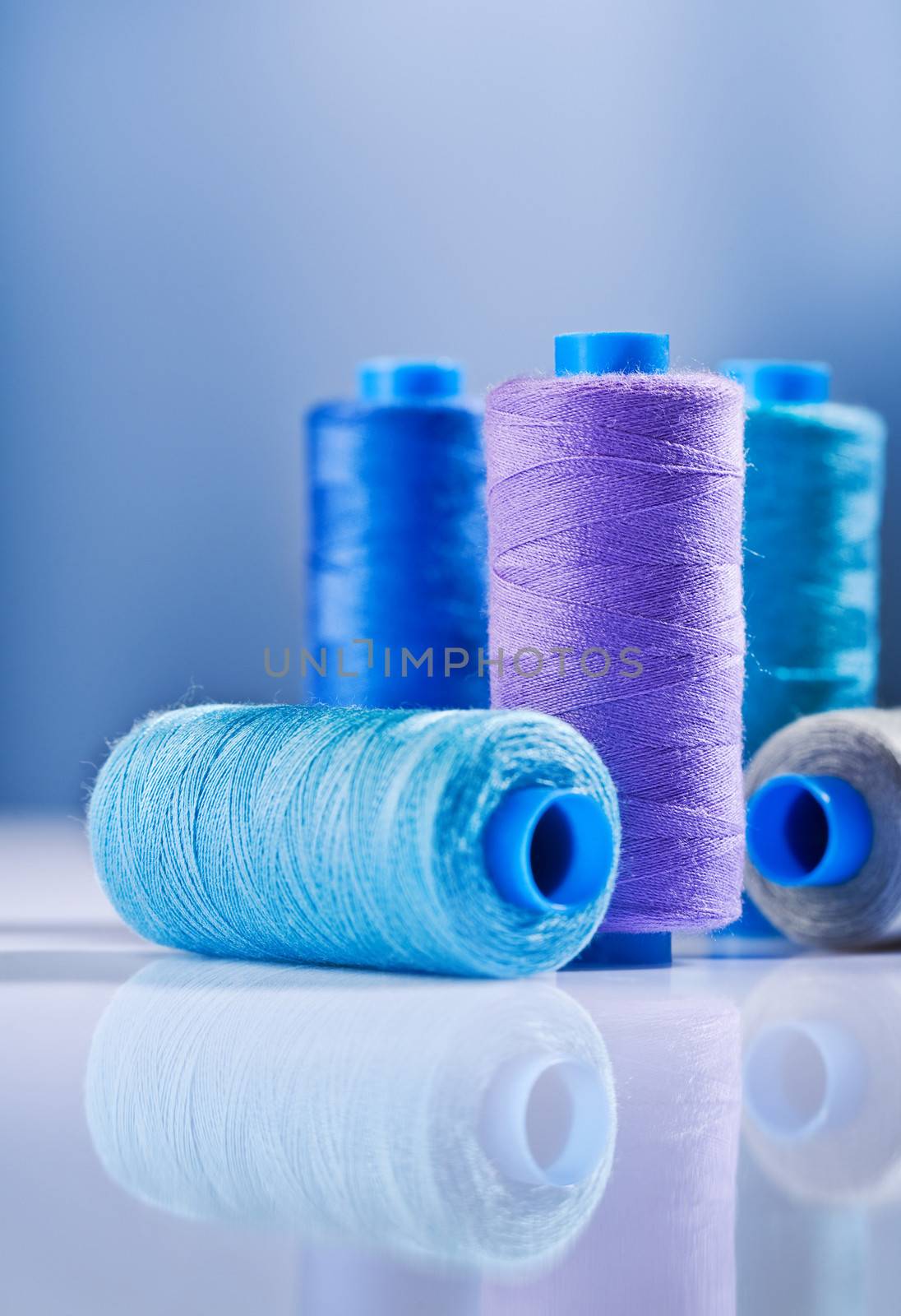five sewing spools