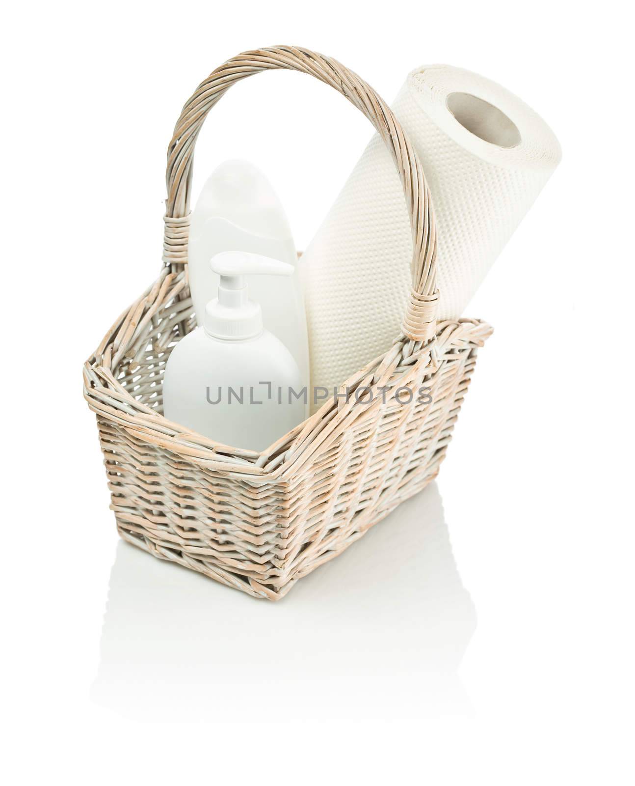 basket with bottles and paper towel