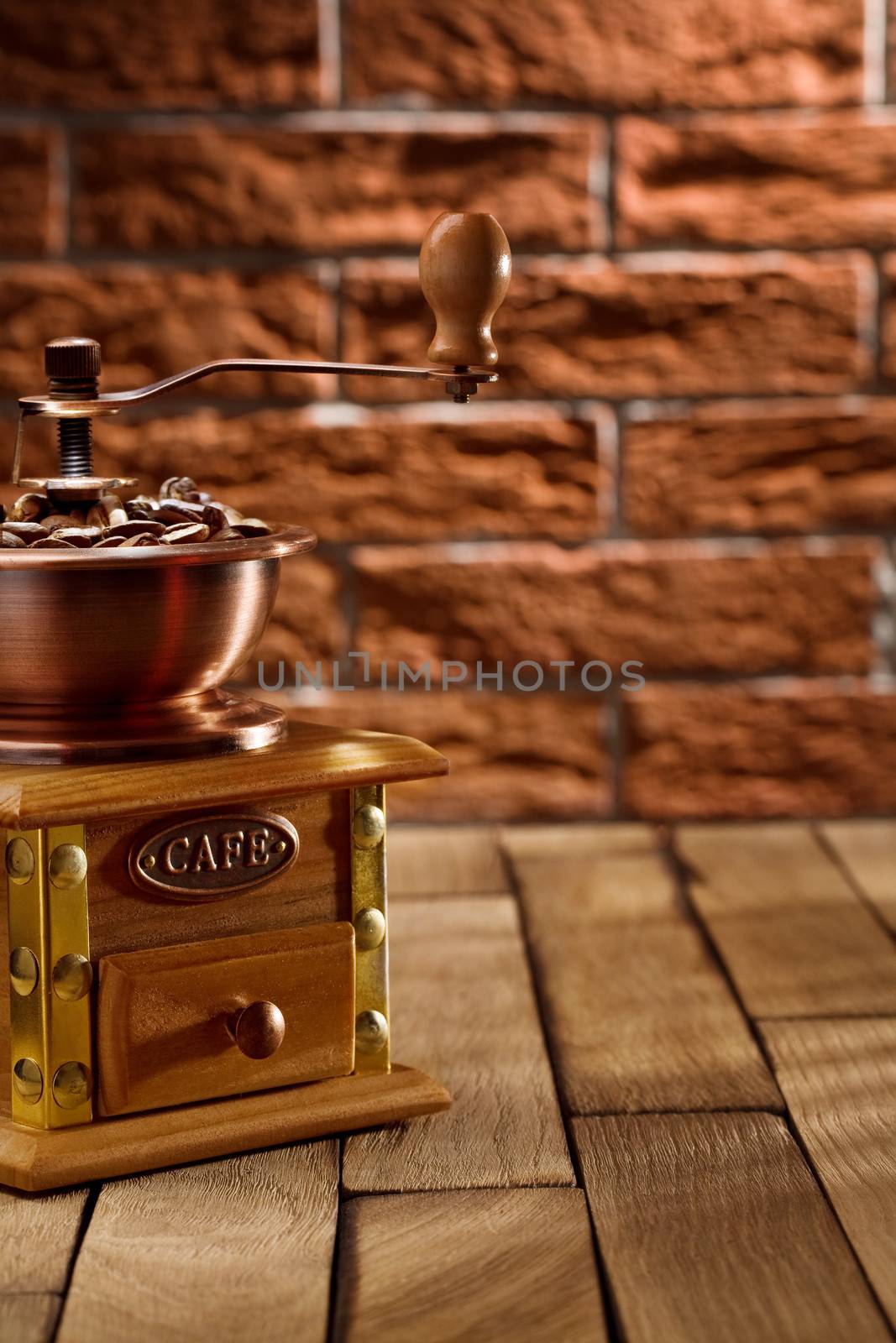 coffee grinder with beans on the table