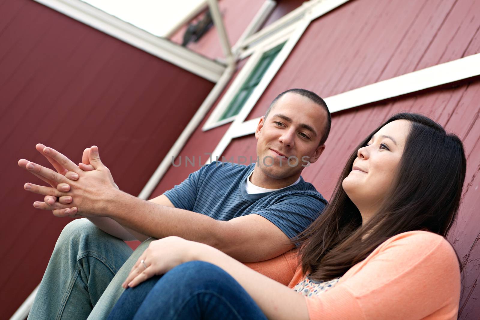 Young happy couple enjoying each others company outdoors.