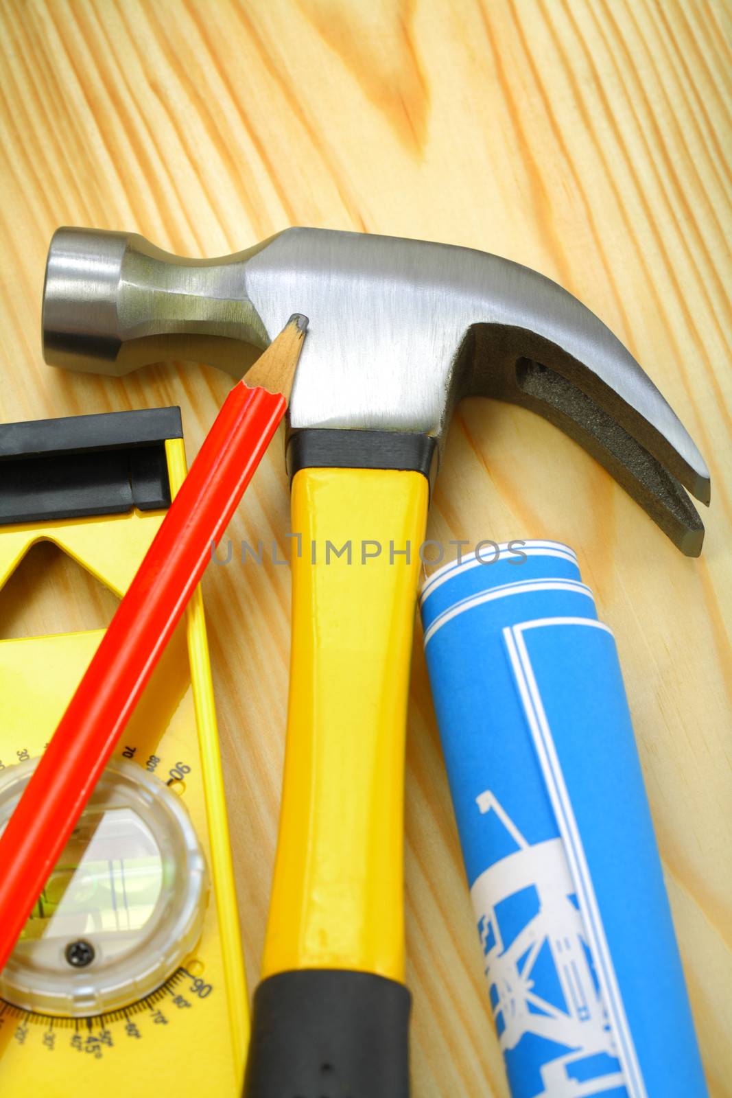 hammer pencil blueprint level on wooden boards