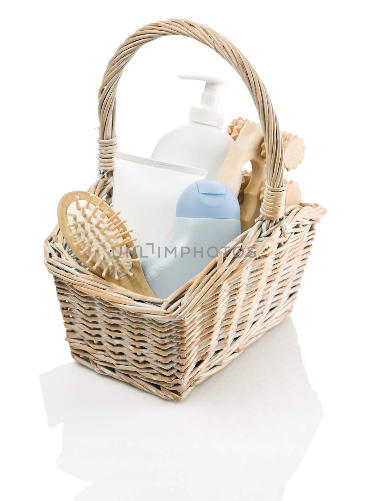 basket with tubes, hairbrush and masseur