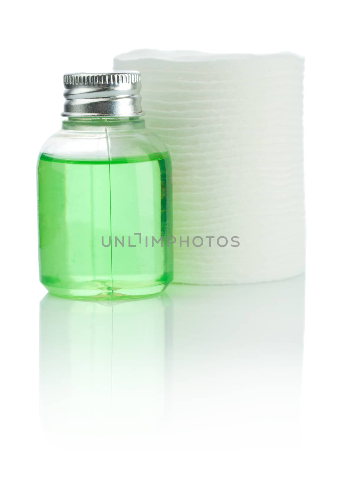 small bottle and cotton pads