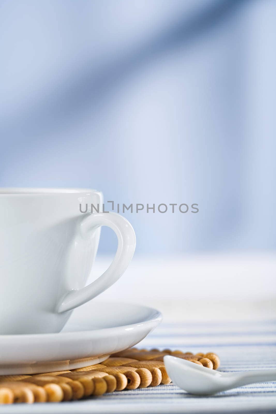 white coffee cup and spoon