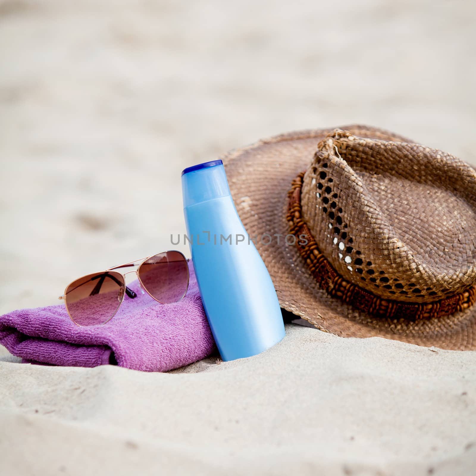 sunprotection objects on the beach in holiday by juniart