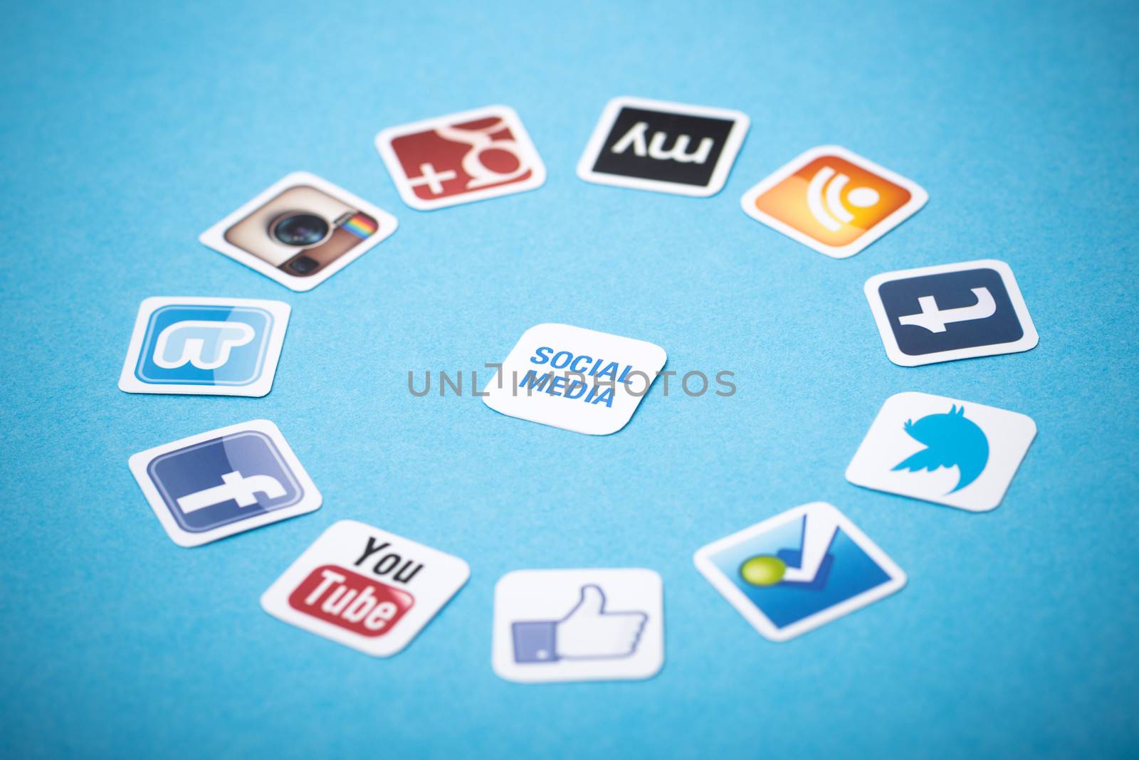 Kiev, Ukraine - June 11, 2013 - A logotype collection of well-known social media brands printed on paper and placed around on a blue background.