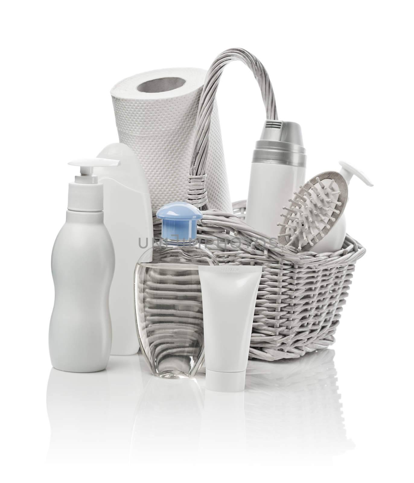 basket with cosmetics, paper towel and hairbrush
