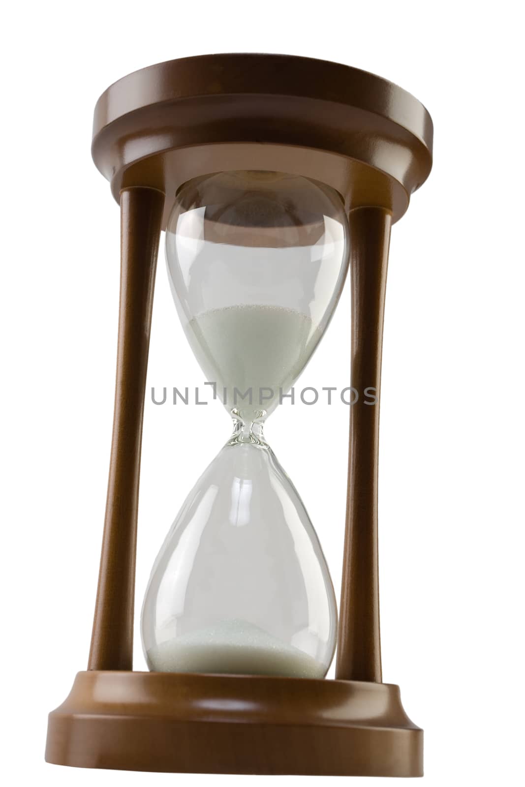 Inclined brown sand glass isolated on white background