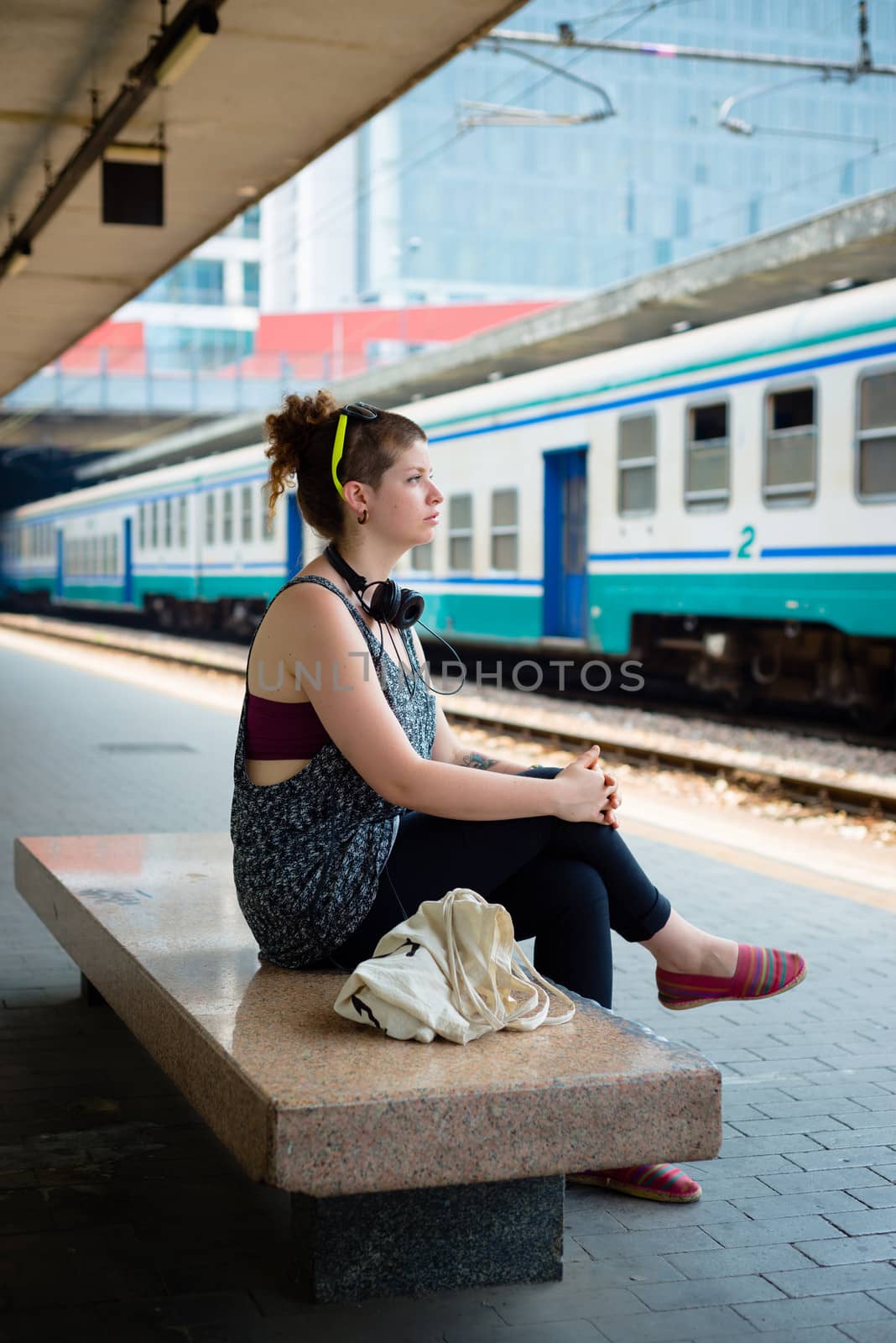 beautiful stylish modern young woman waiting train by peus