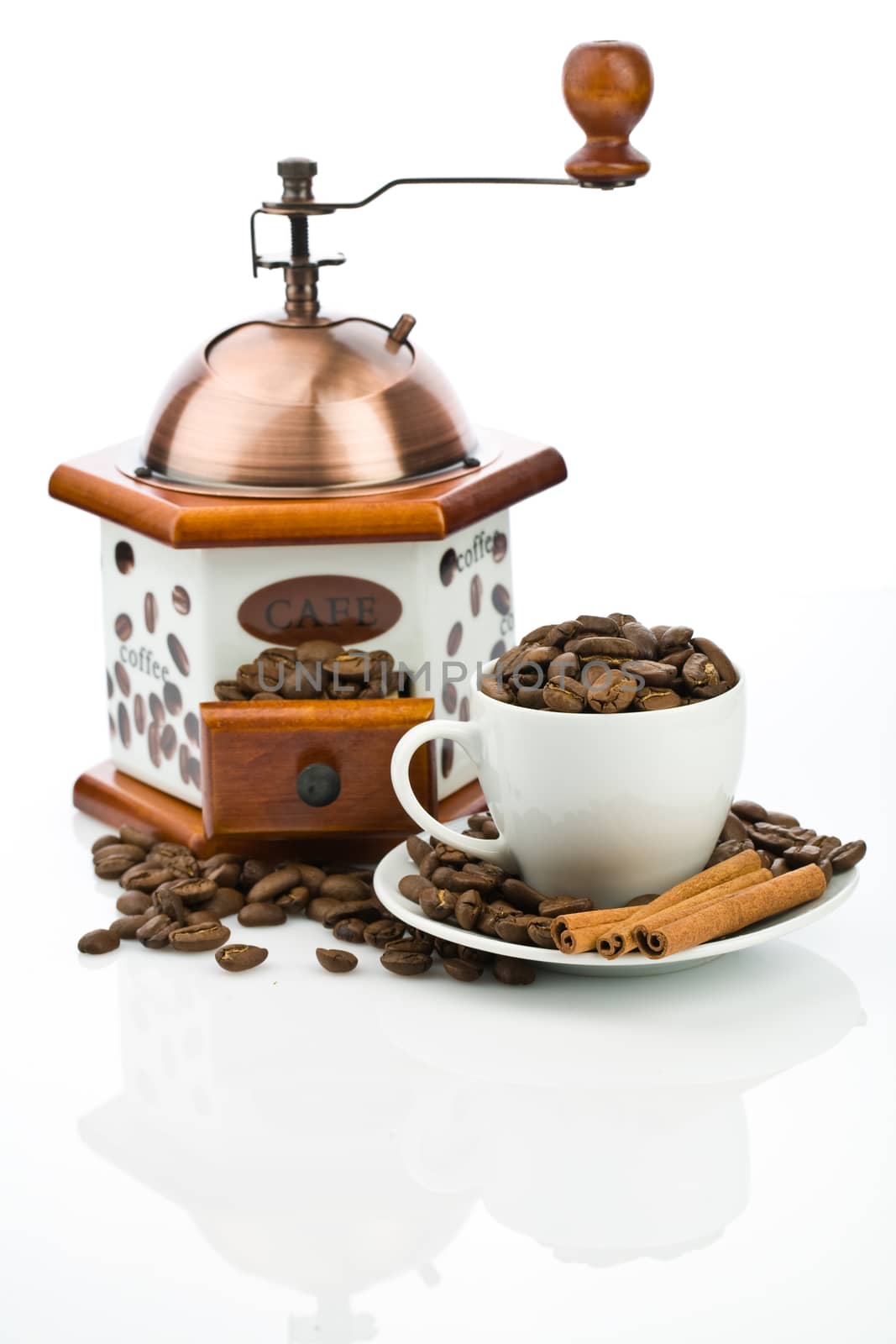 cup and mill with beans isolated