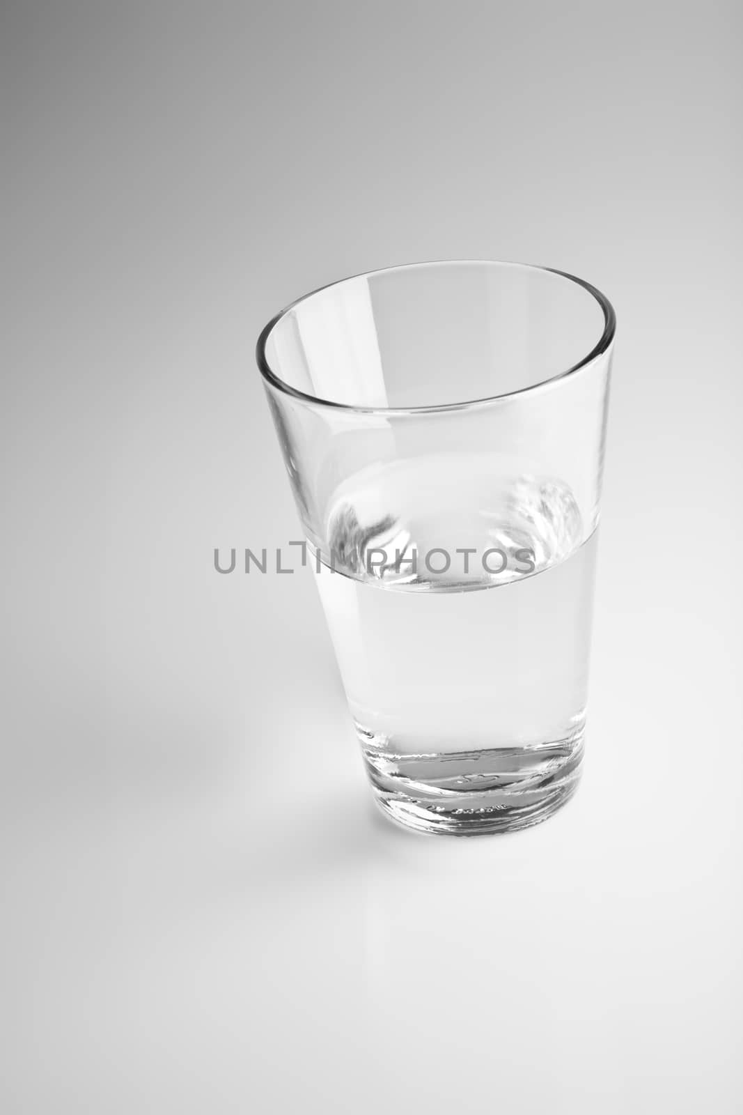 glass on a blurry gray background