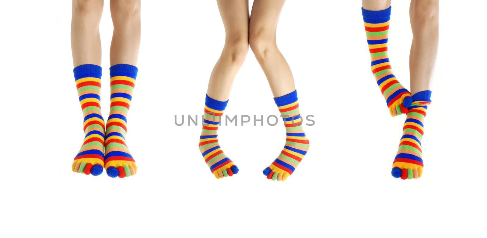 Three couples of woman legs in stripped socks