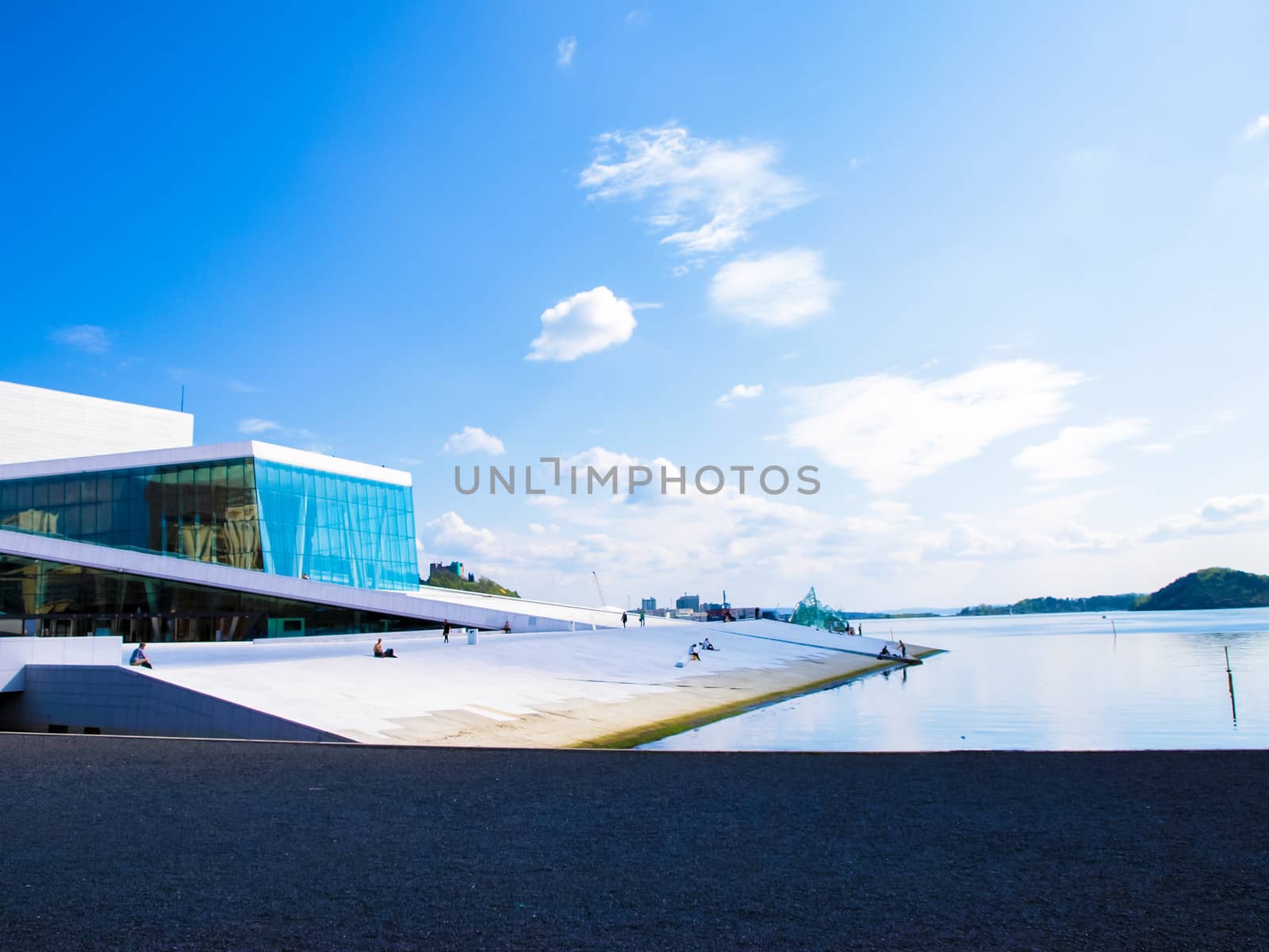 Opera house in Oslo Norway, white building towards fresh blue sky at harbor