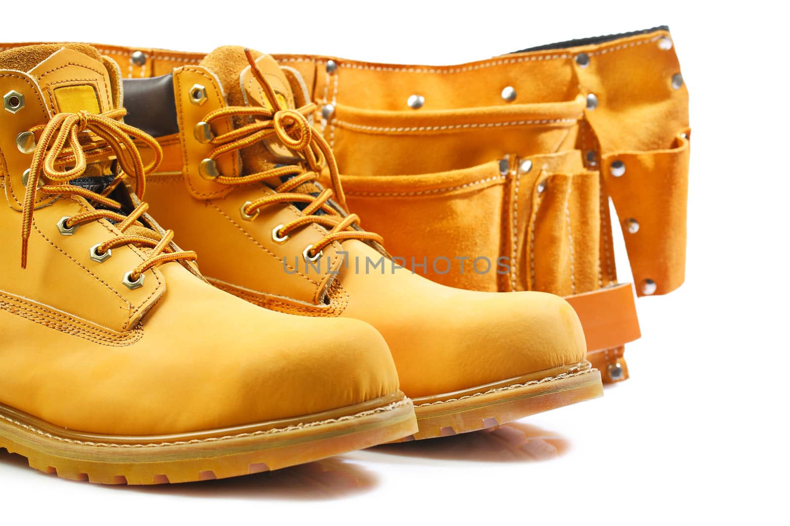 pair of working boots and tool belt isolated