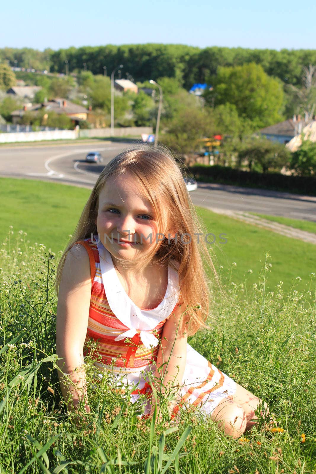 portrait of little fashionable girl on the nature