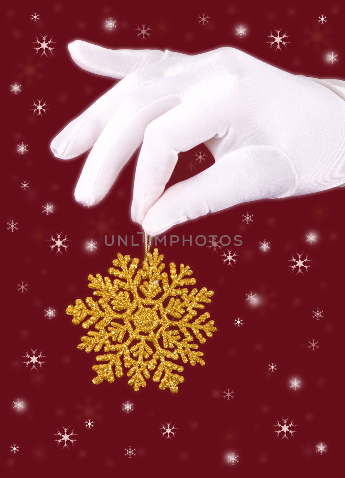 closeup picture of woman's hands holding a snowflake