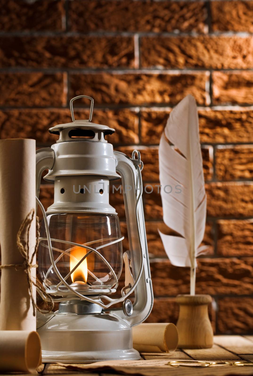 composition of old writing items and kerosene lamp