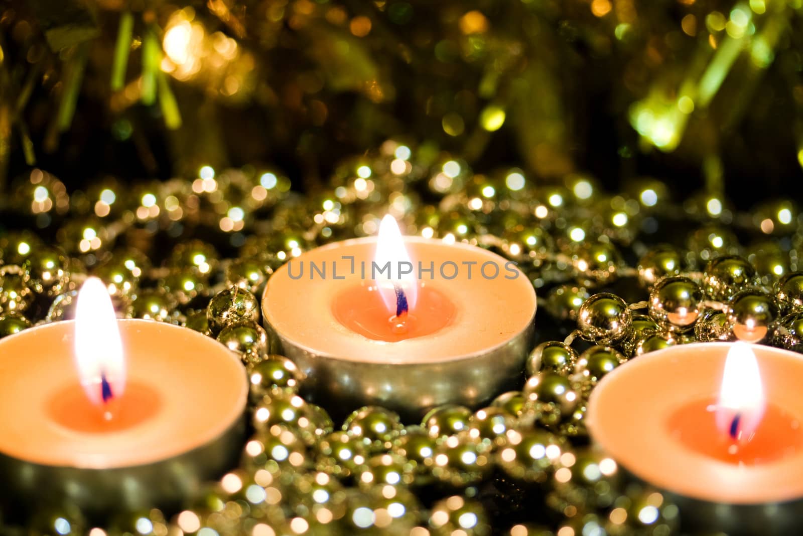 Burning candles on a background blur