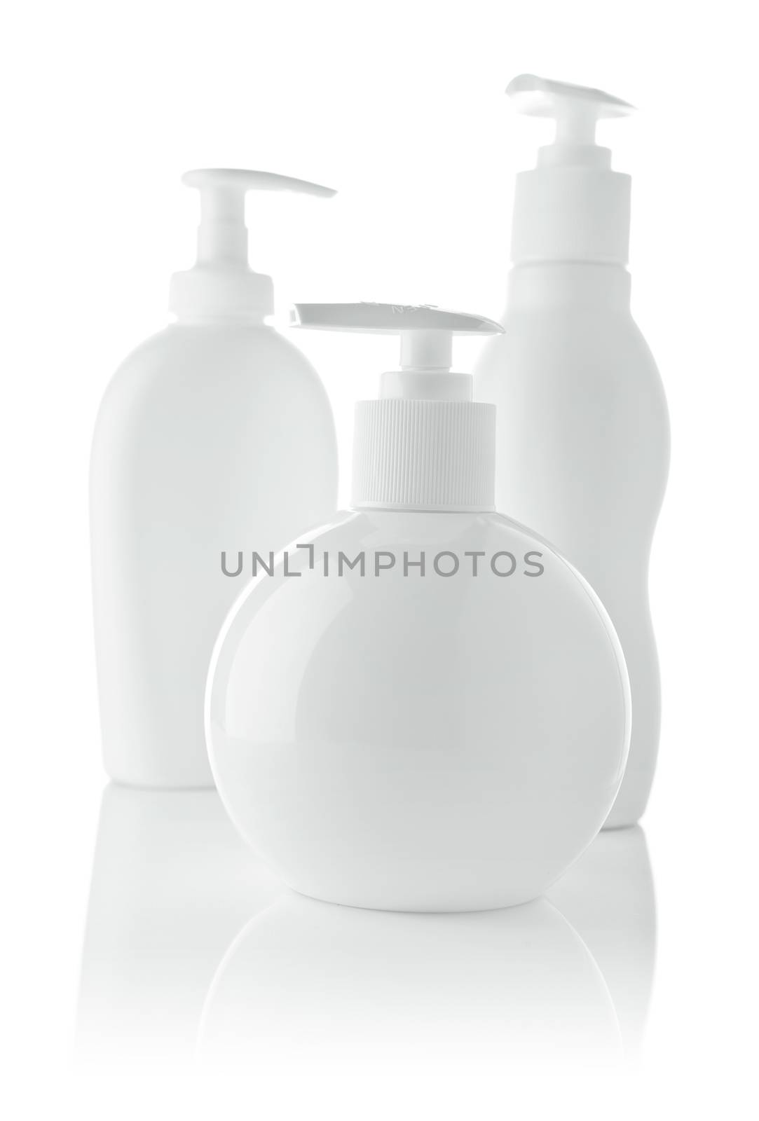 three white spray bottles