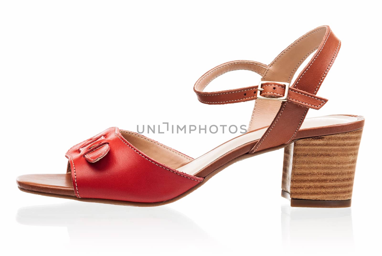 Red female sandal shoe isolated over white background