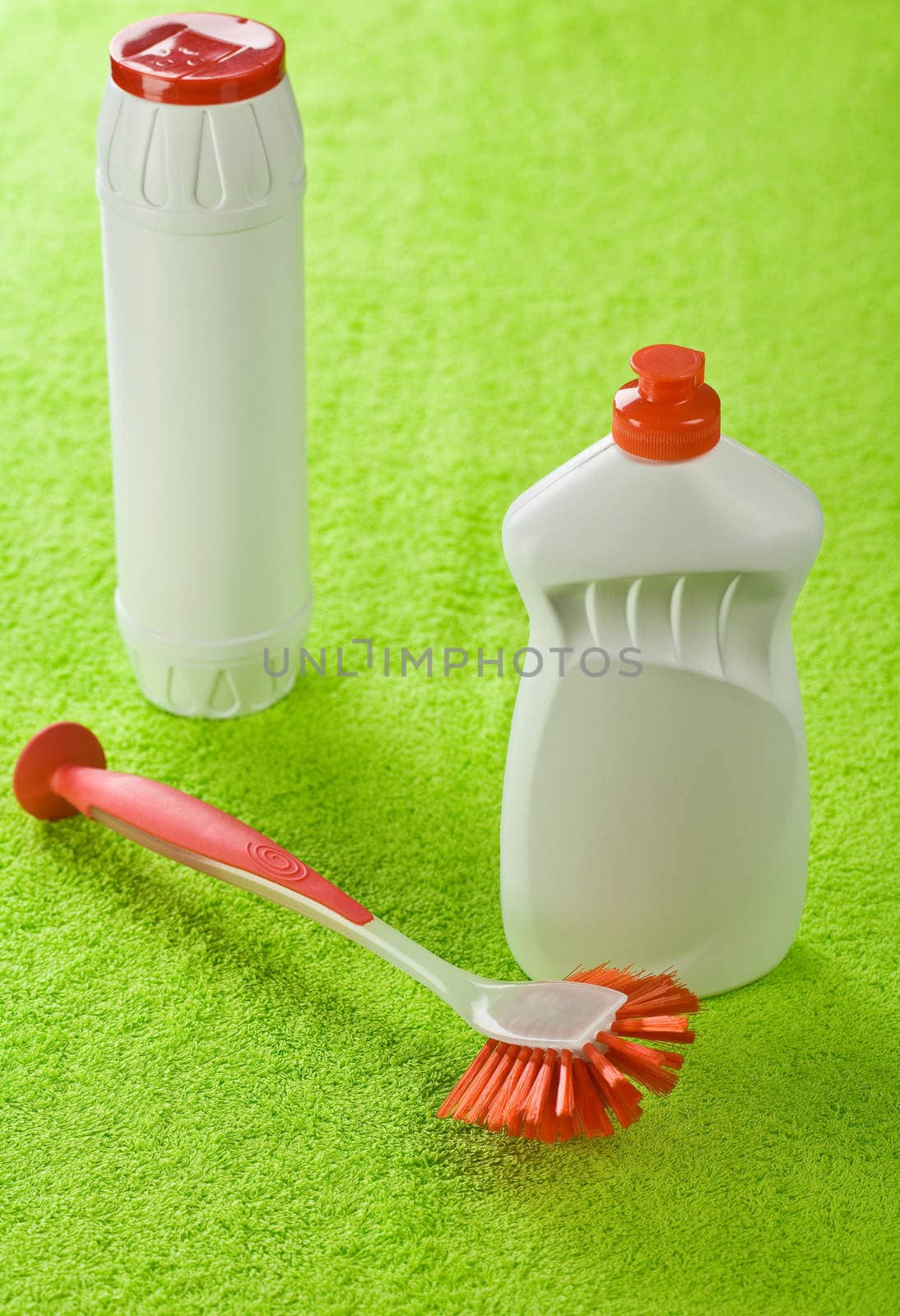 bottles and brash on green towel
