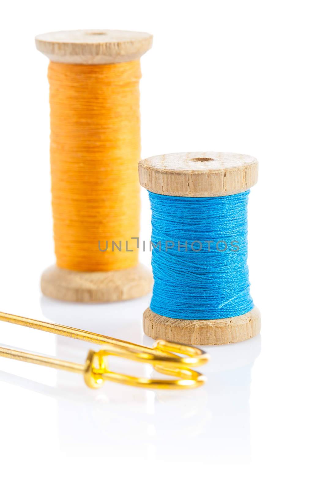 sewing bobbins and safety pin