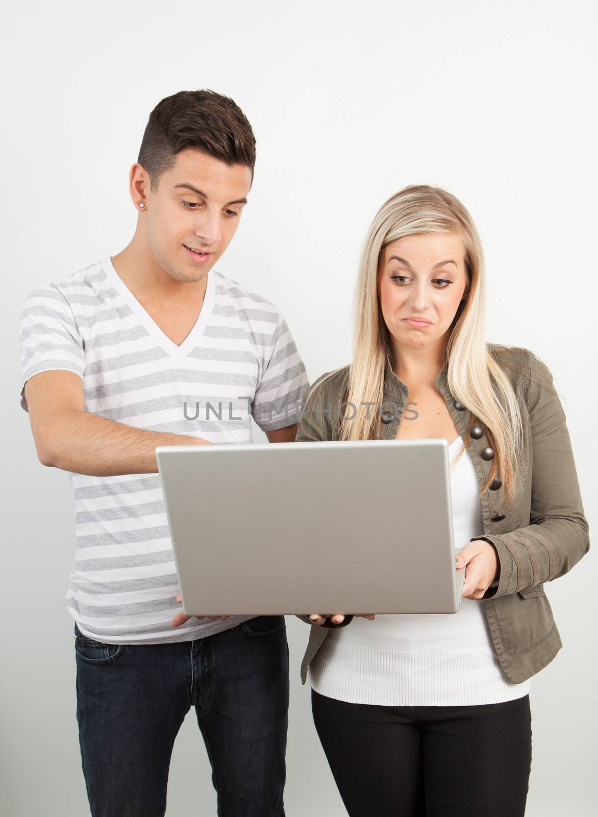 Students using a laptop against a white background