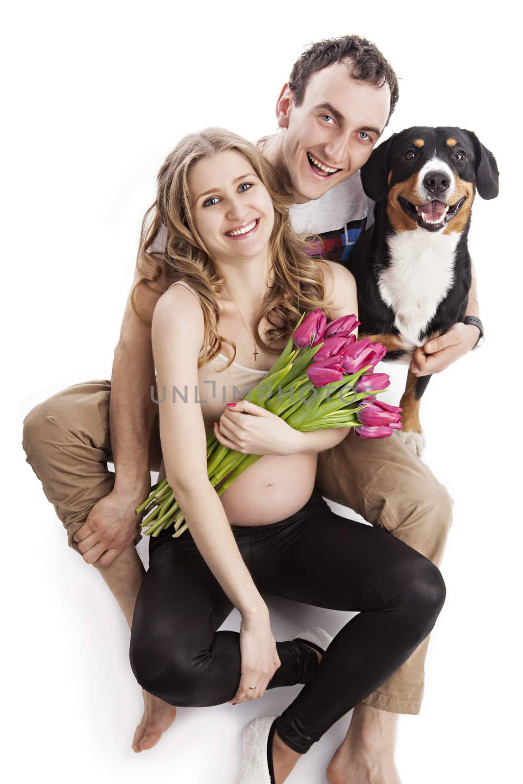 Pregnant couple and Entlebucher Sennenhund dog by photobac