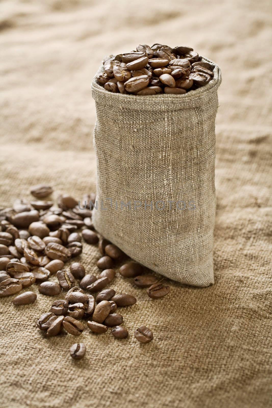 coffee grains in bag on sacking