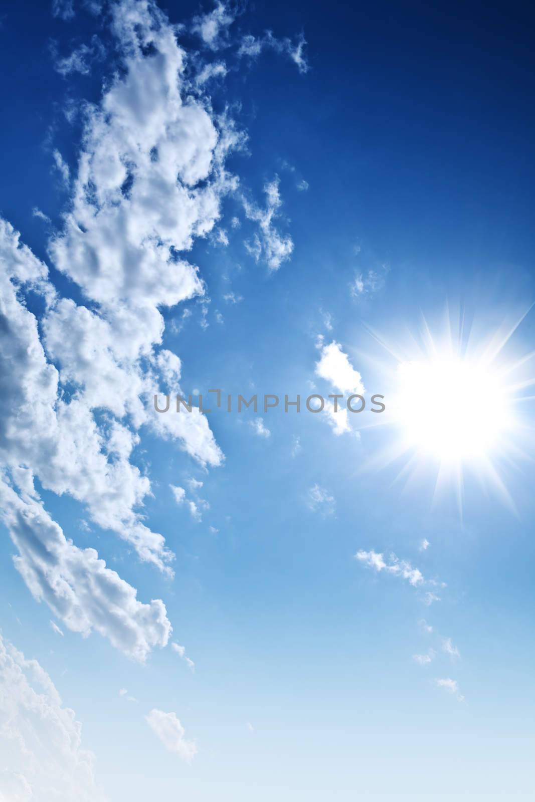 blue cloudy sky and sun