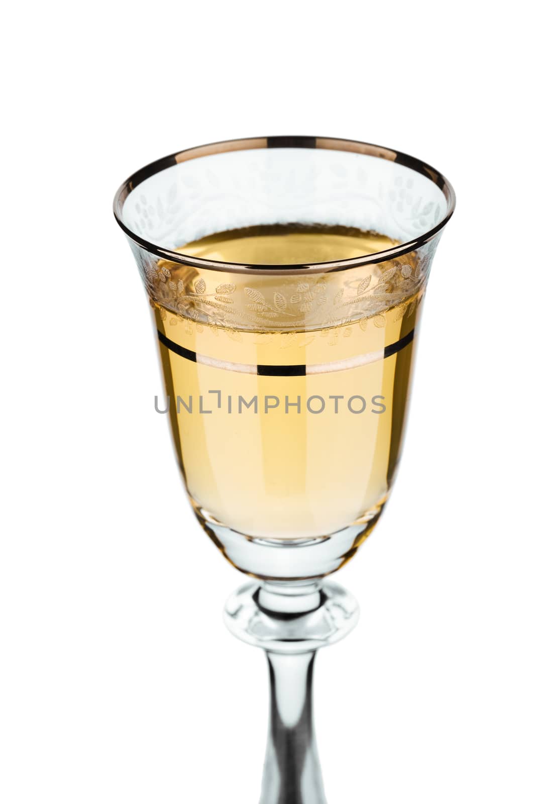 isolated section of wineglass with white wine