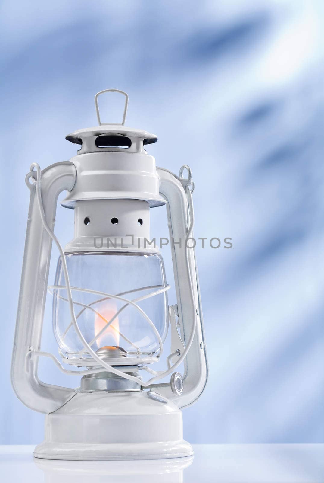 kerosene lamp on blue background