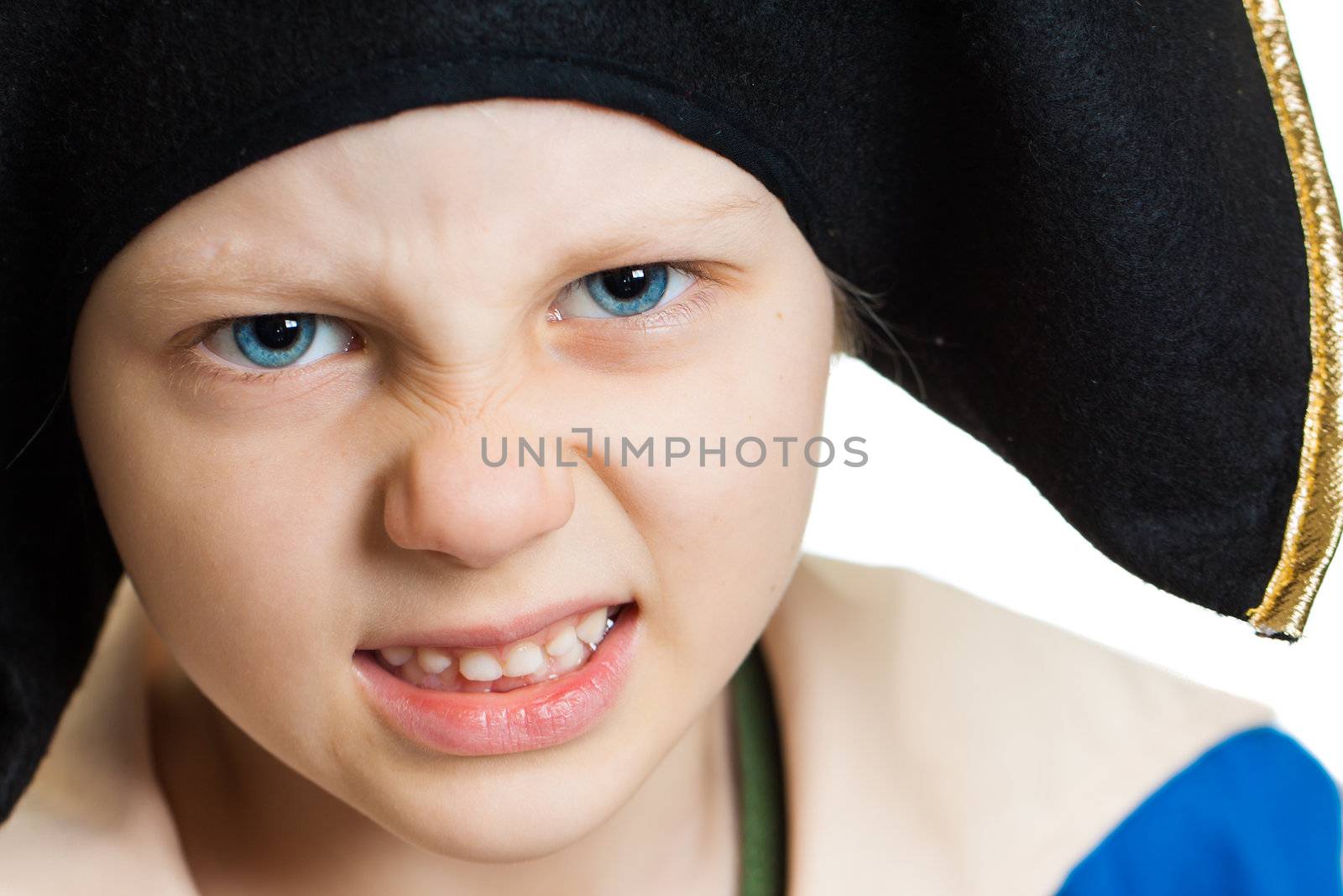 A close-up portrait of a grumpy angry pirate boy. Isolated on white.