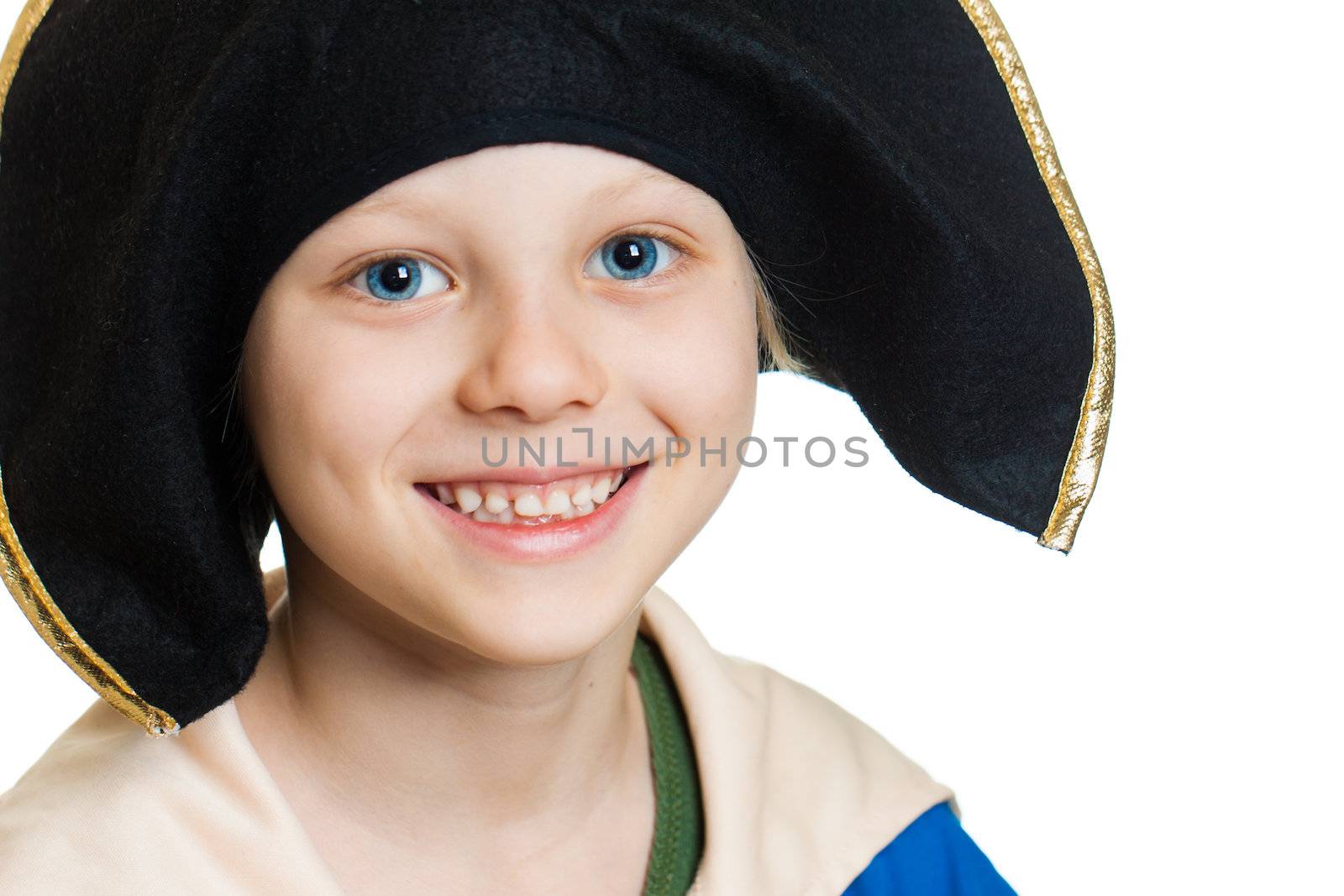 A close-up portrait of a smiling happy boy dressed as pirate. Isolated on white.