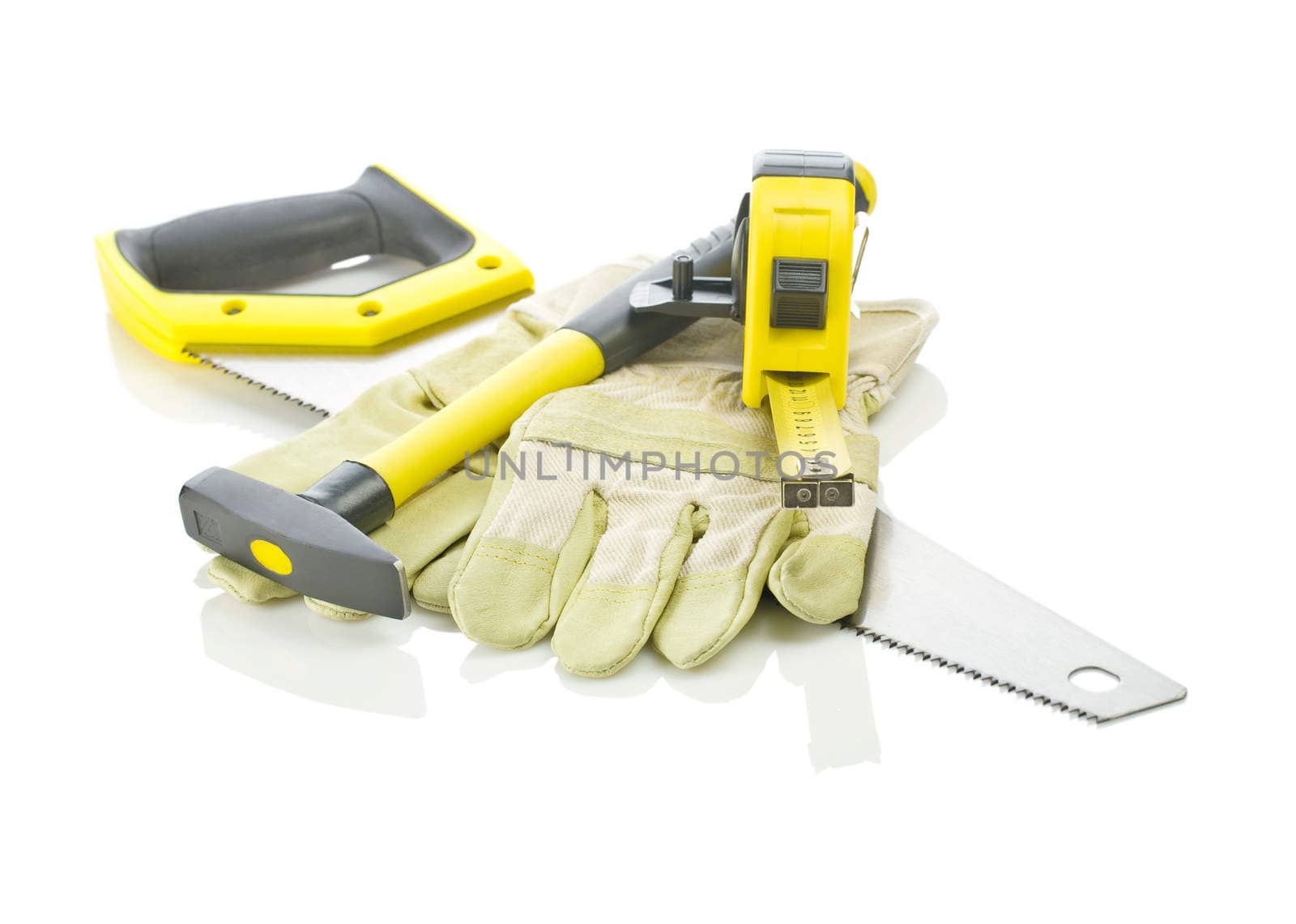 tapeline, hammer and gloves on saw