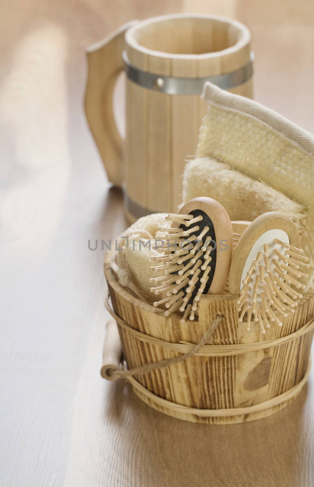 bucket and mug on wooden background