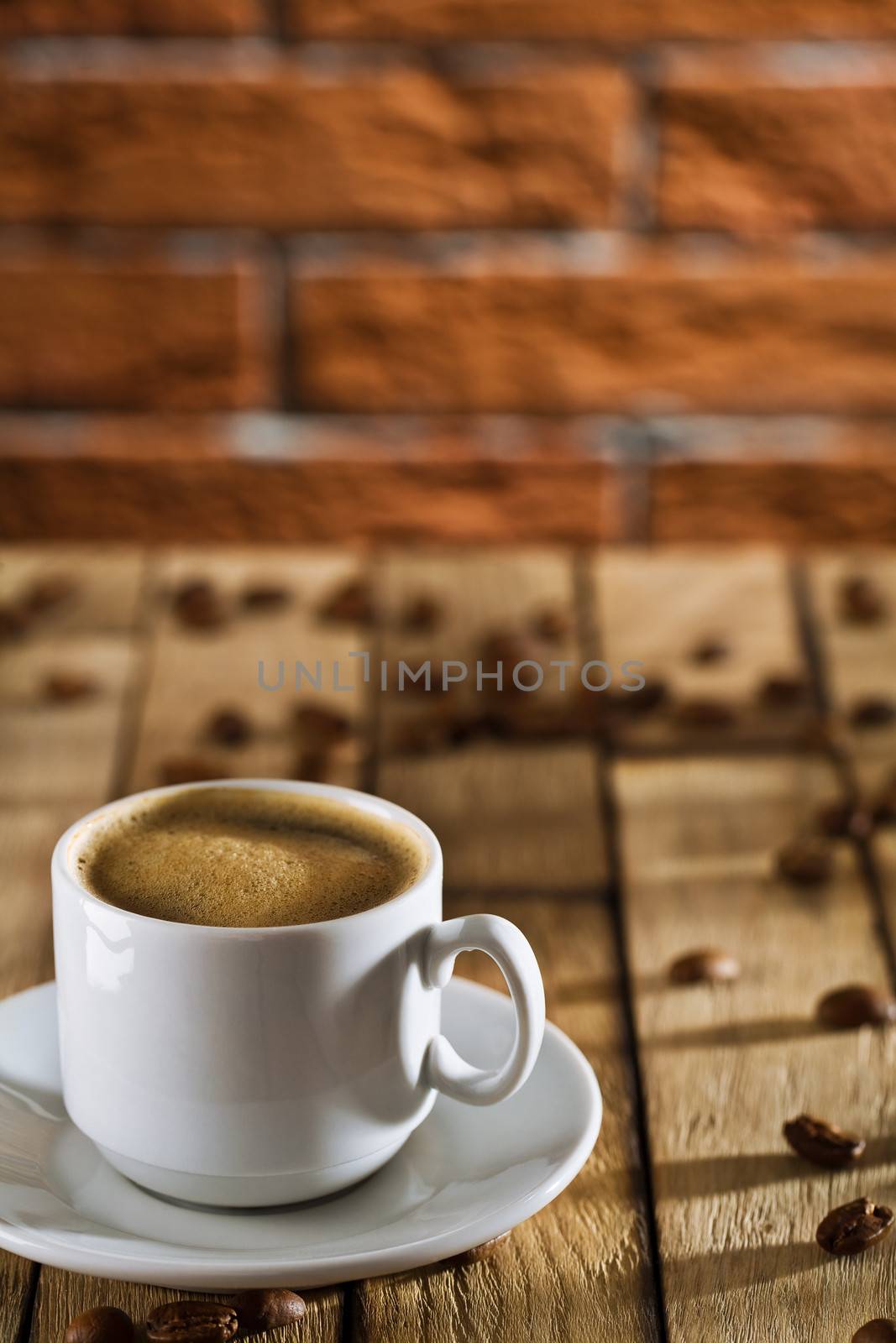 cup with espresso on the wooden boards