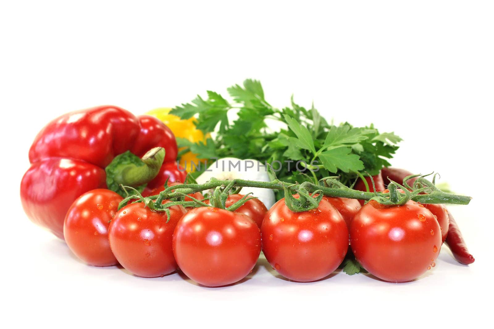 different varieties of vegetables in front of white background