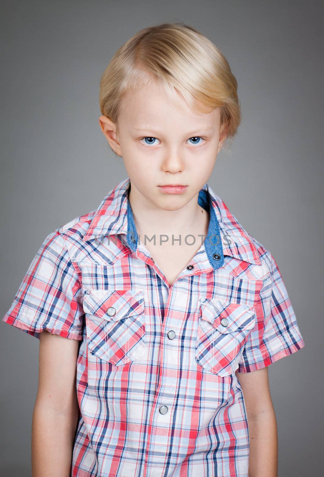 Sad grumpy young boy by Jaykayl