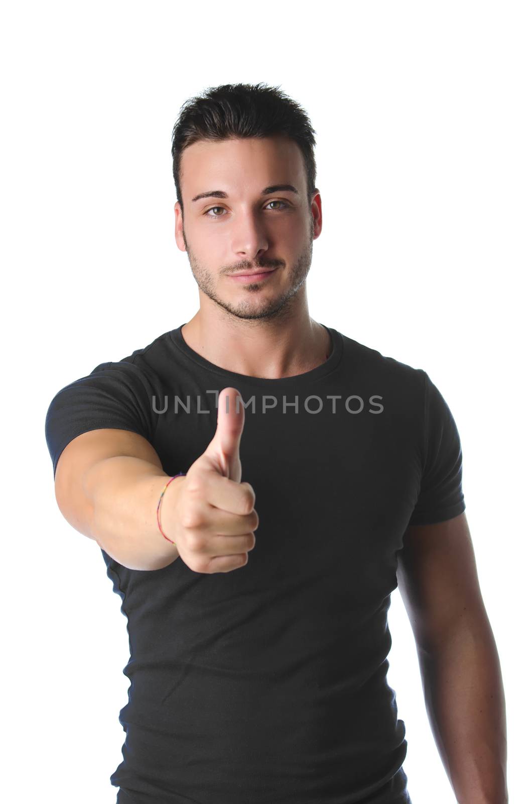 Handsome and muscular young man with thumb up doing OK sign, isolated on white