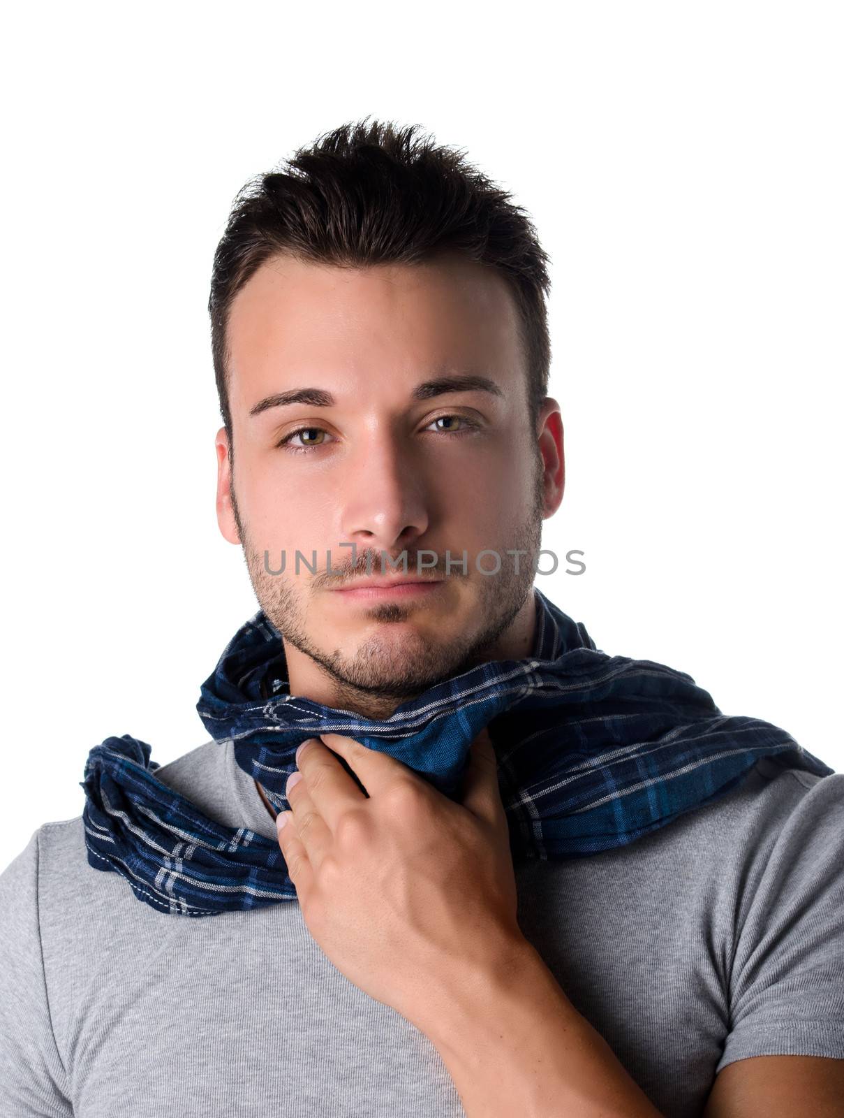 Suffering young man with scarf, holding his neck because of throat ache