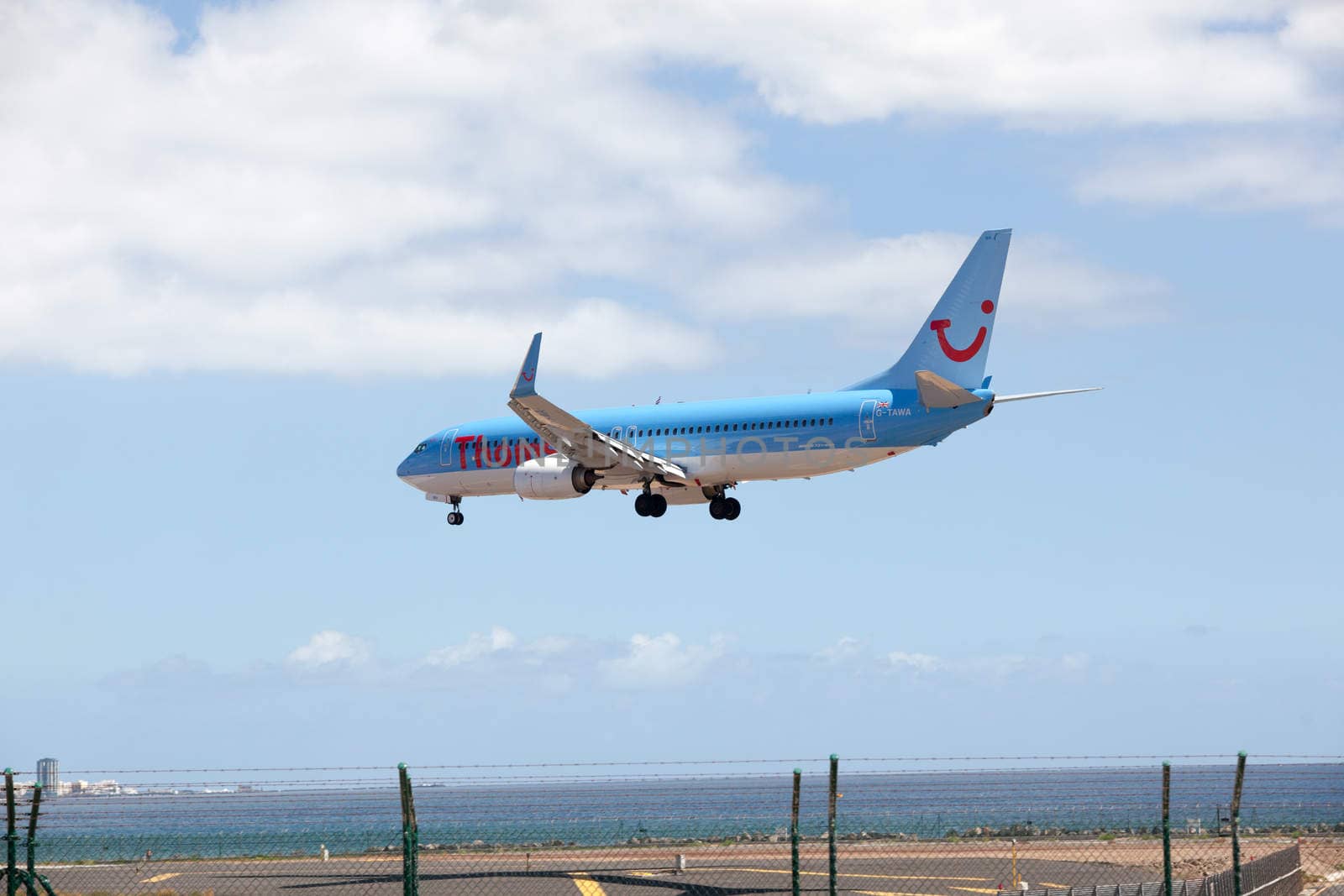 Arrecife, Spain, Mars 24.2013: Thomson one Boeing 737-800 is coming in for landing at the Airport on Lanzarote