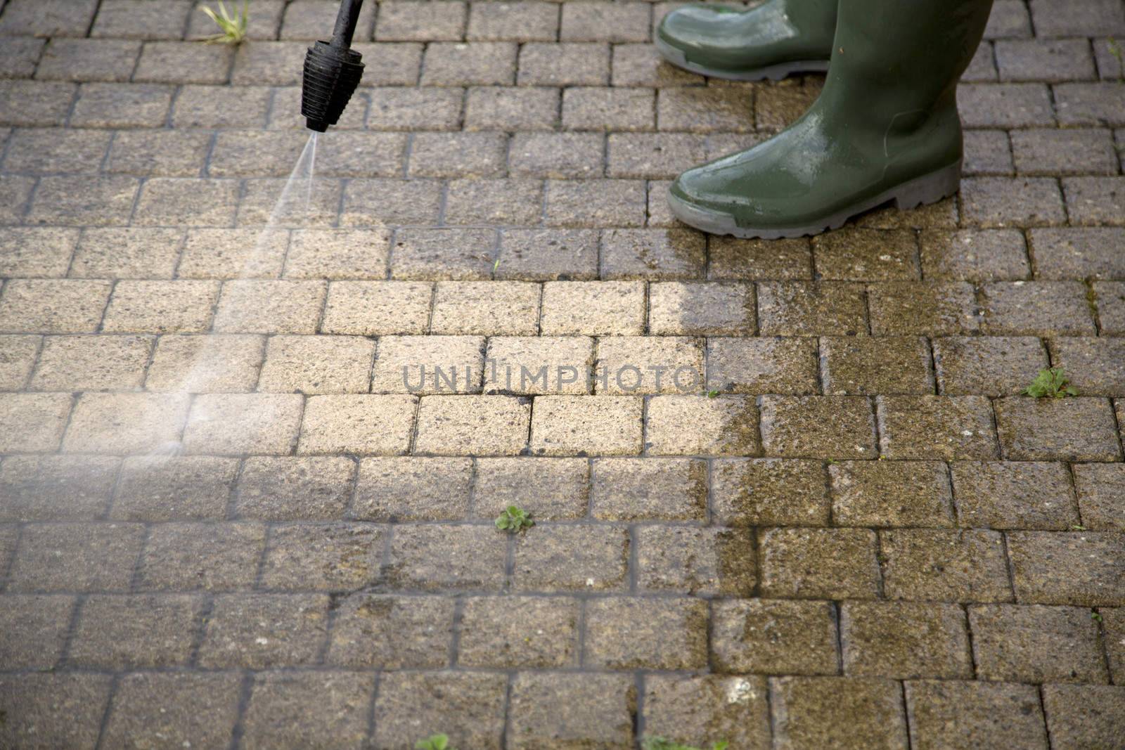 Outdoor floor cleaning with high pressure water jet