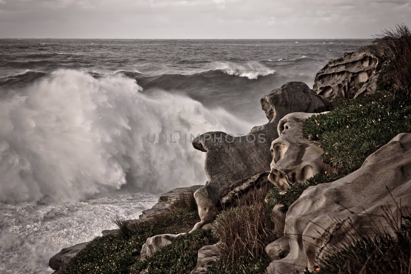 Splashing waves at Whitby beach, Yorkshire, England