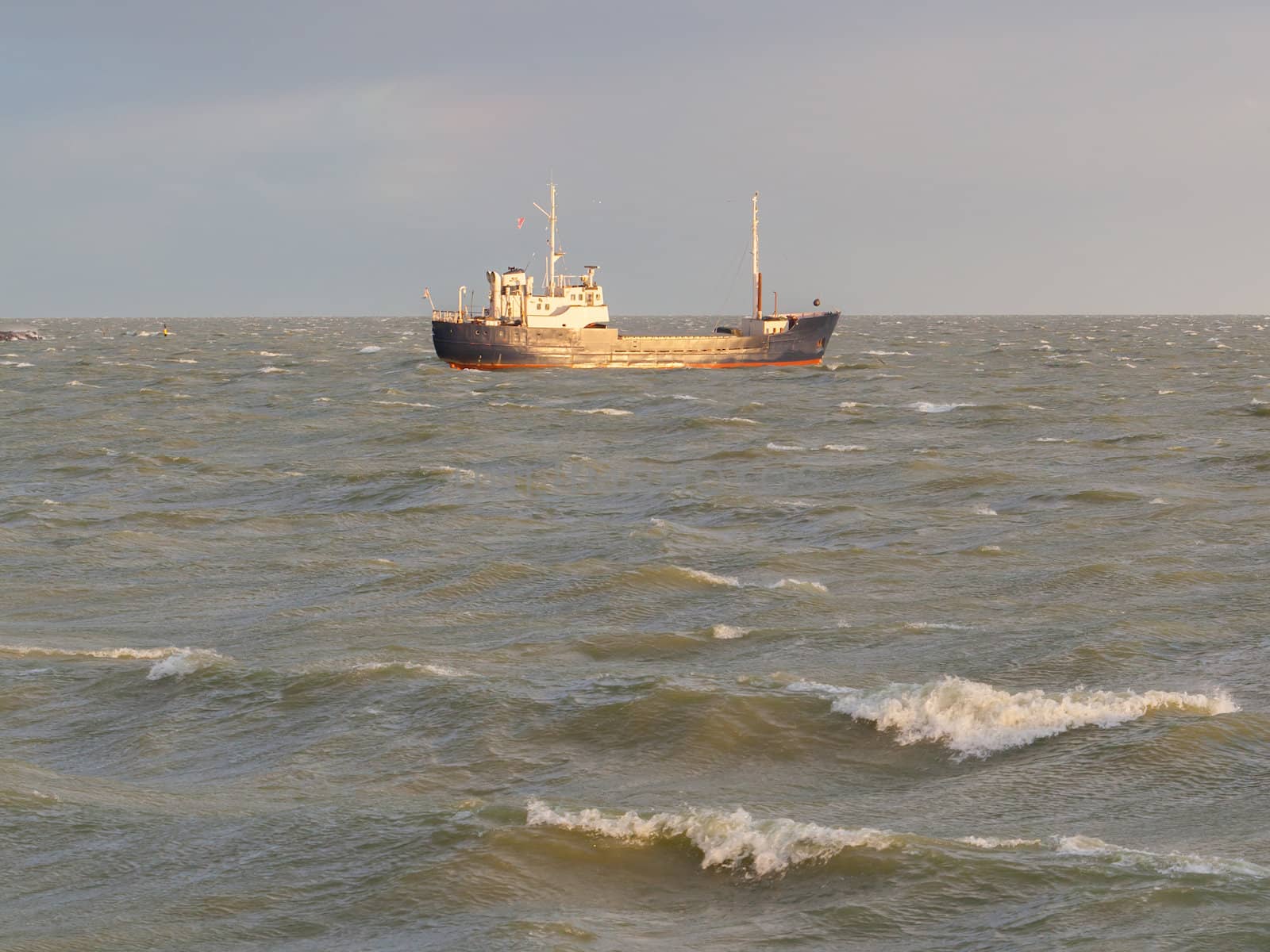 Small coastal vessel in the waters of the dutch Ijsselmeer by michaklootwijk